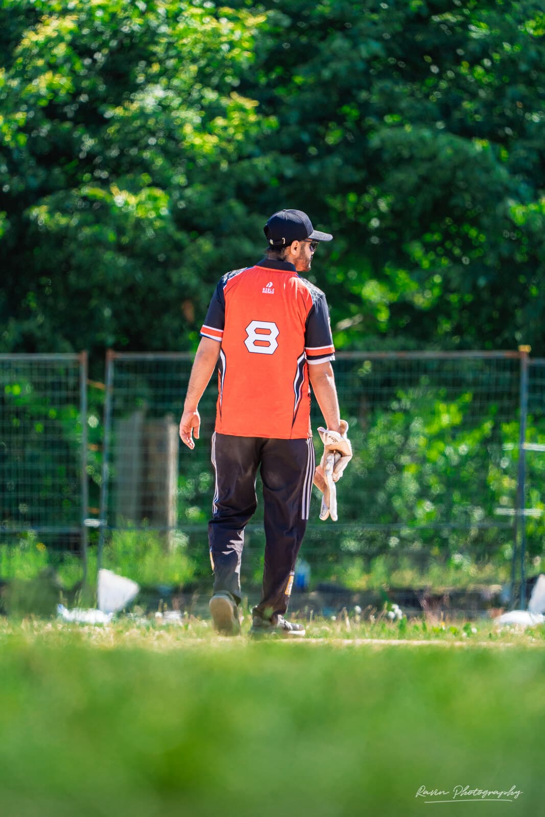 Cricketer walking off the pitch after batting, Nova Scotia