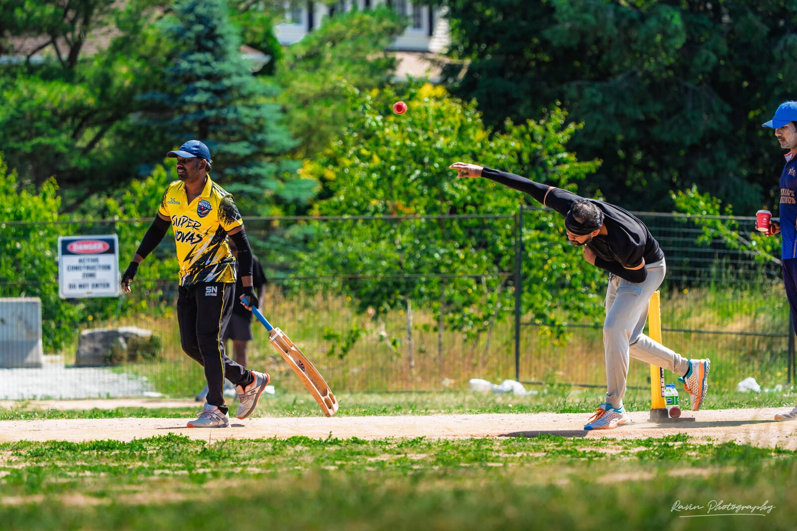 Cricket bowler at full stretch during delivery, Nova Scotia