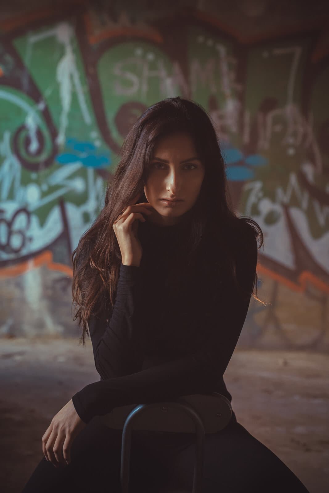 Editorial portrait with dramatic magenta smoke lighting