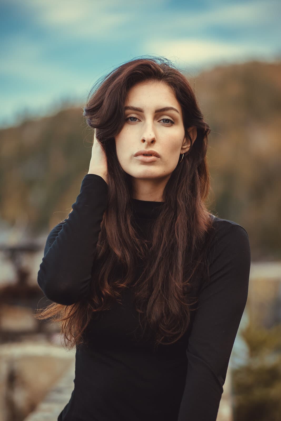 Editorial portrait against an urban graffiti mural