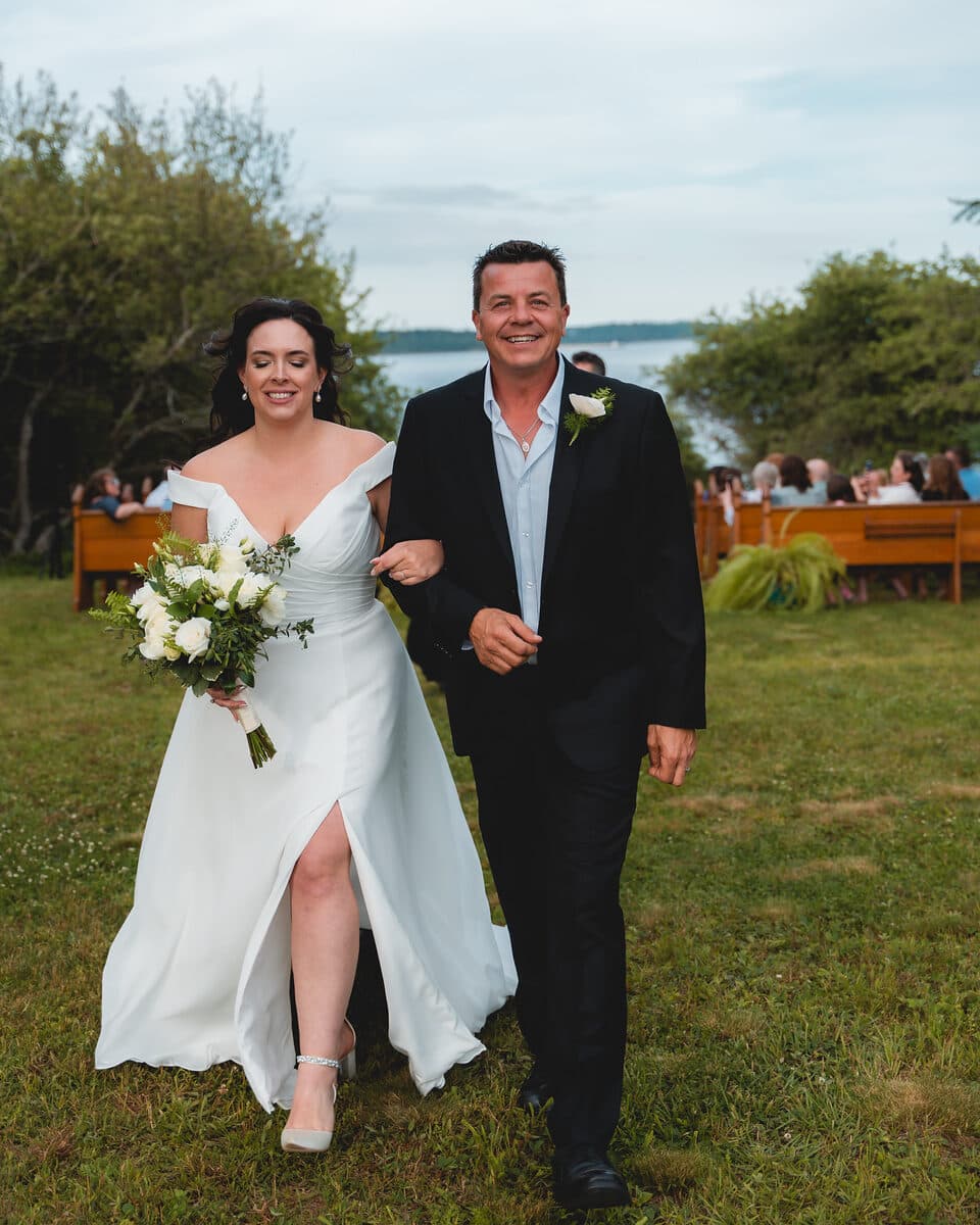 Newlyweds walking back down the aisle after the ceremony