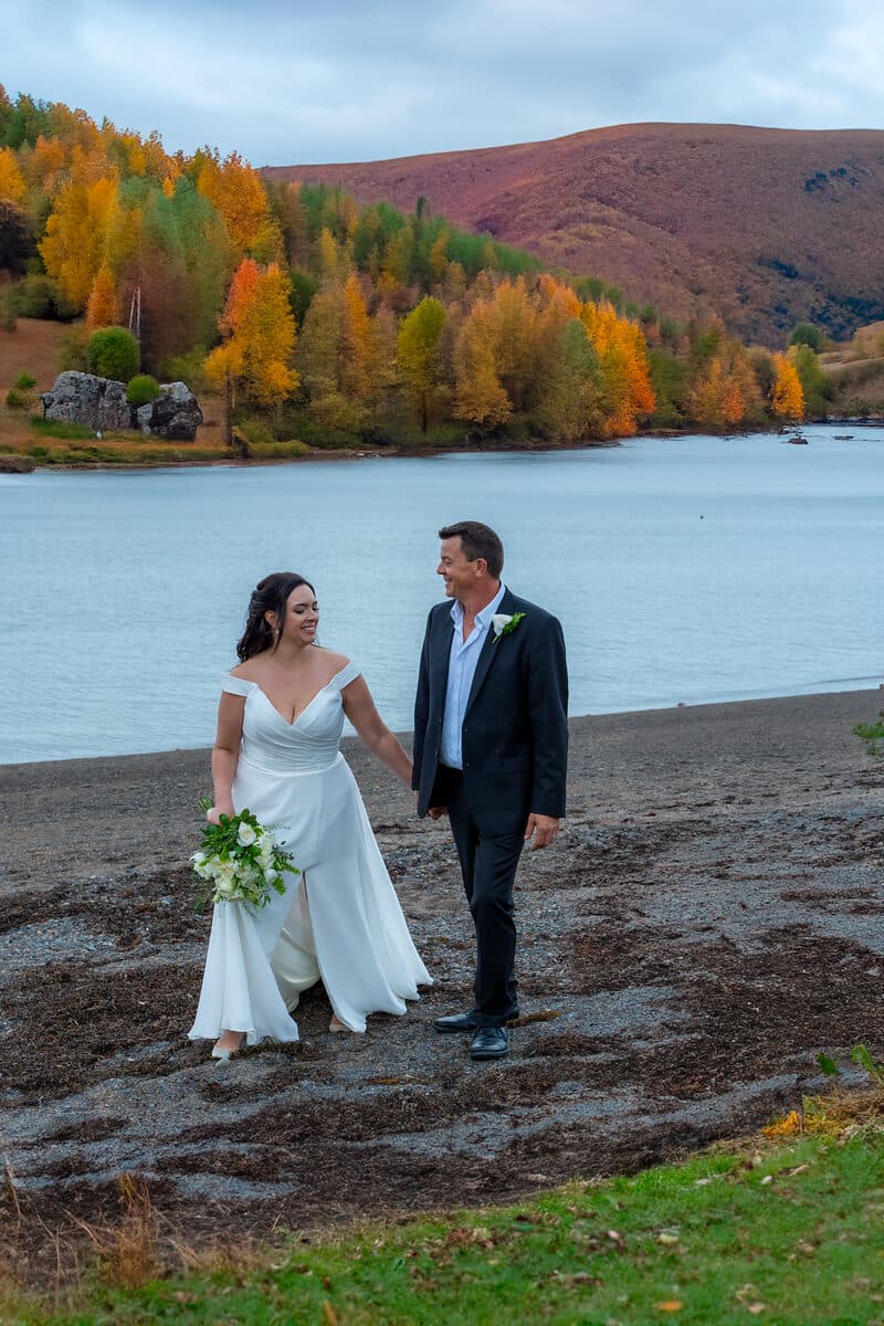 Wedding couple on the shoreline in autumn, Nova Scotia
