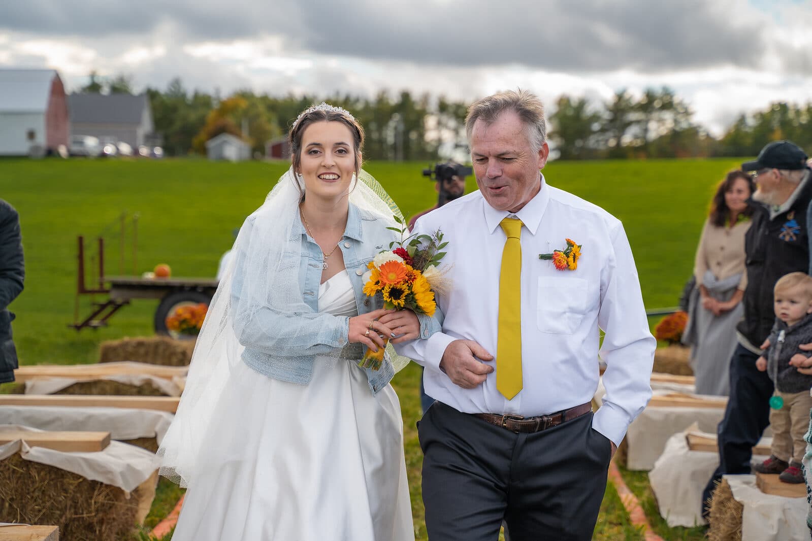 Wedding couple among sunflowers in an autumn Nova Scotia field