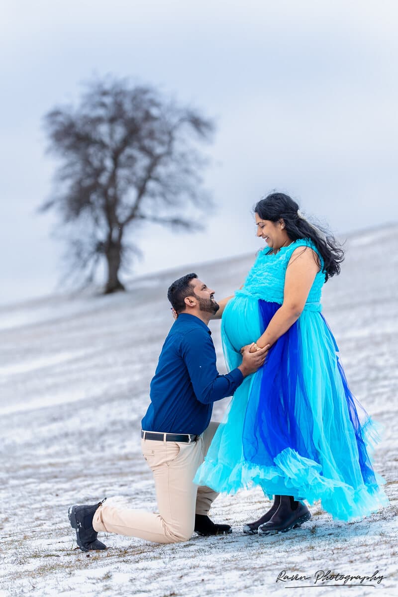 Winter maternity session with a lone tree on the horizon, Nova Scotia