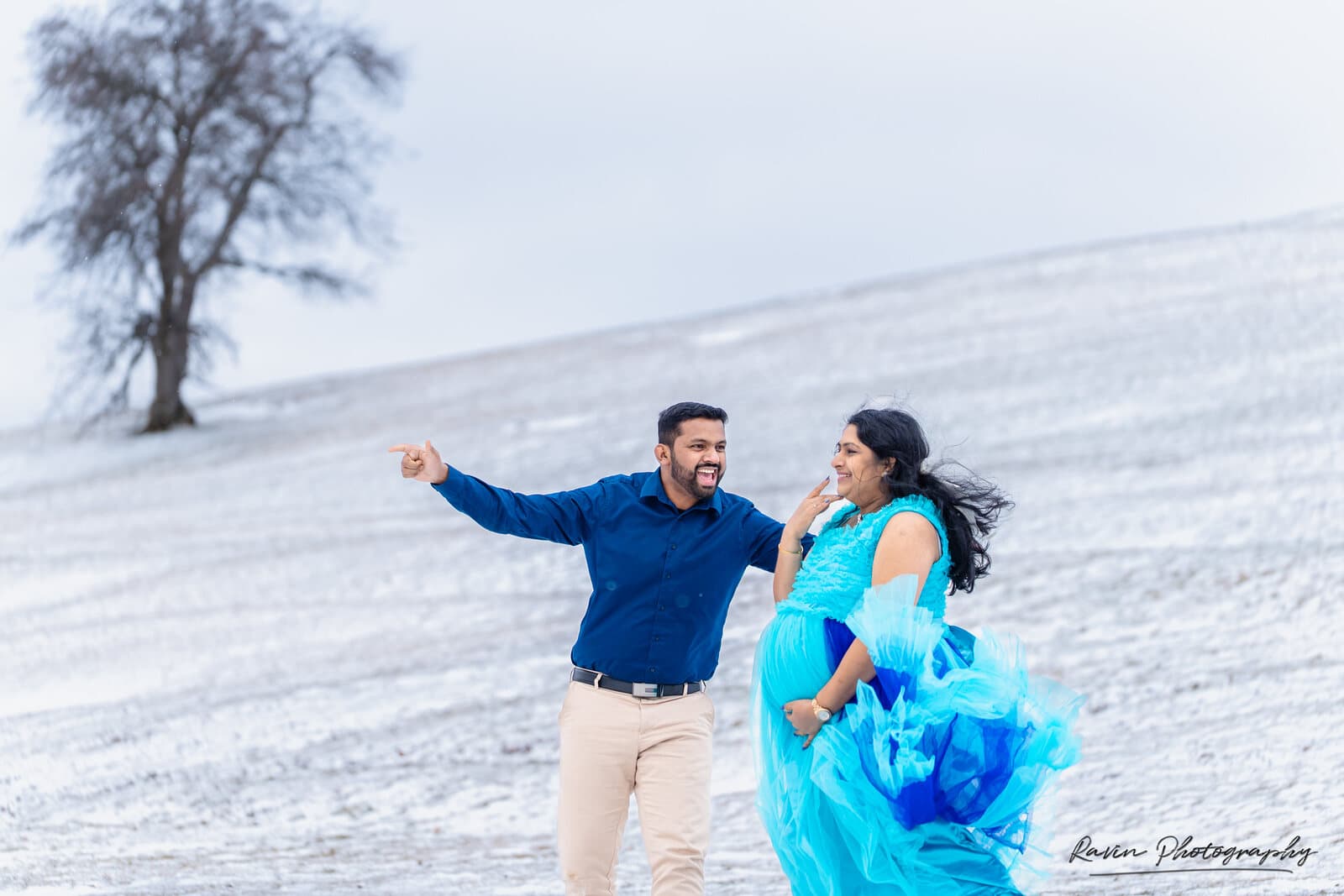 Expectant couple together in the snow, Nova Scotia winter maternity photography