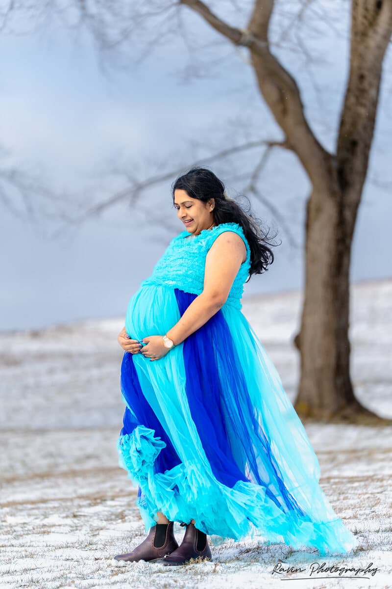 Winter maternity portrait in a snow-covered field, Halifax Nova Scotia