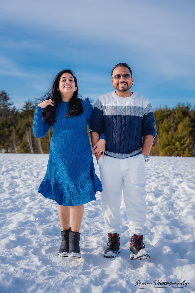 Expectant couple in the snow during a Nova Scotia maternity shoot