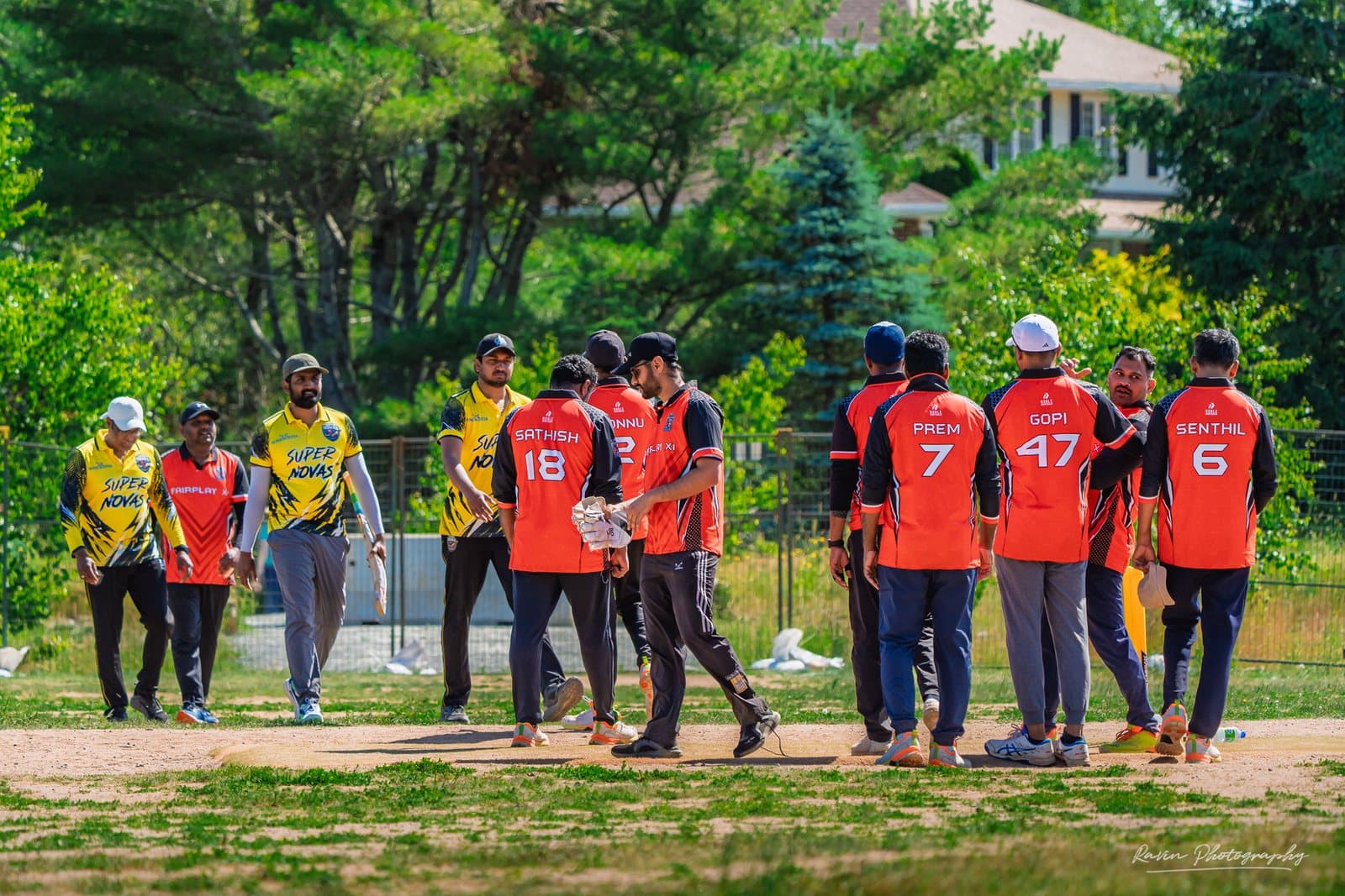 Two cricket teams meeting mid-pitch after a match in Halifax, Super Novas in yellow