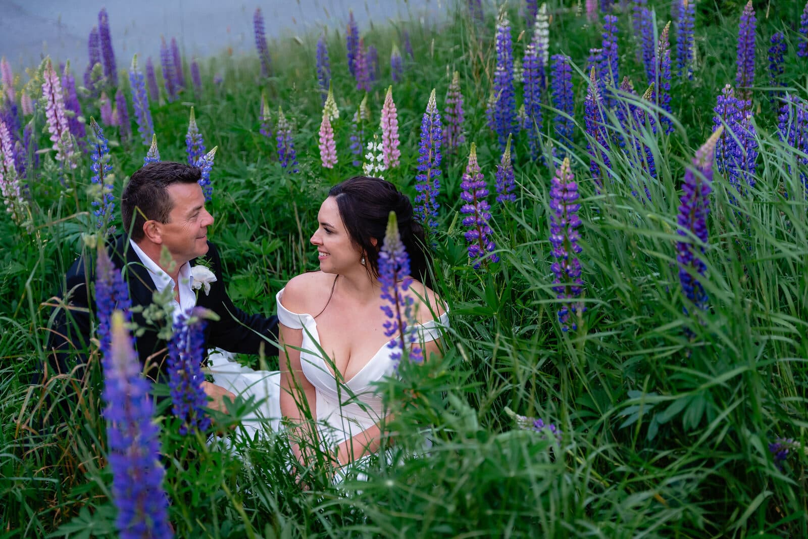 Wedding couple photographed among lupins in Nova Scotia